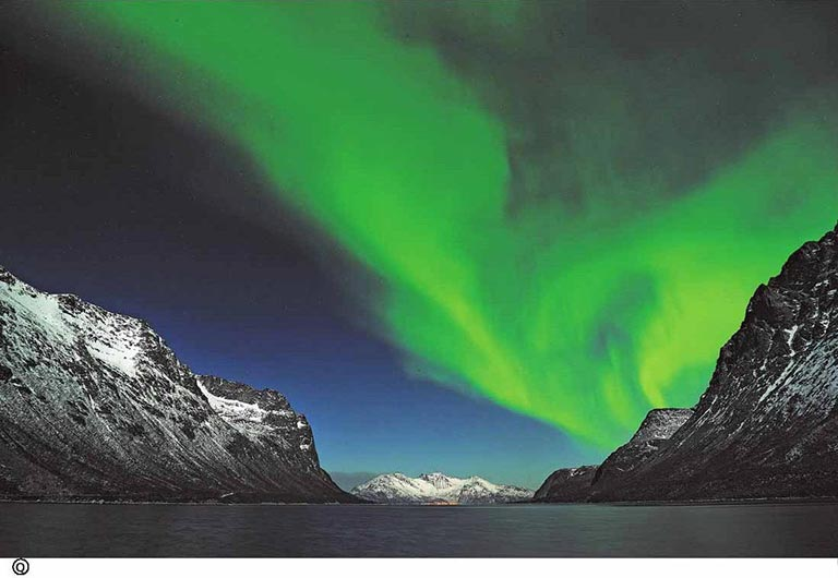 Why are there beautiful aurora over the polar regions?